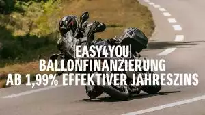Suzuki GSX-S1000GX auf kurviger Straße. Im Vordergrund steht der Hinweis auf die „EASY4YOU Ballonfinanzierung ab 1,99 % effektiver Jahreszins“.